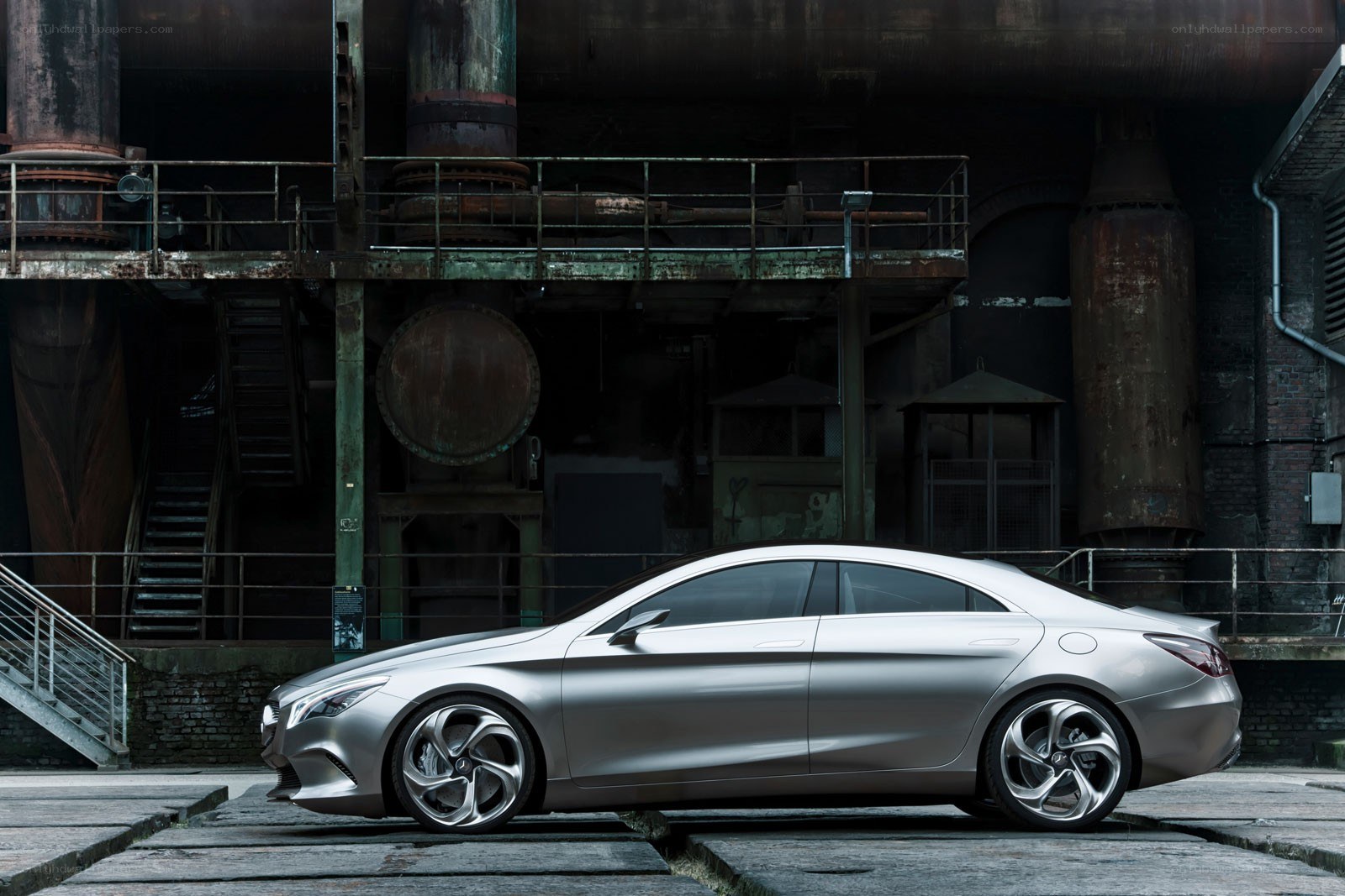 Silver concept car in industrial setting