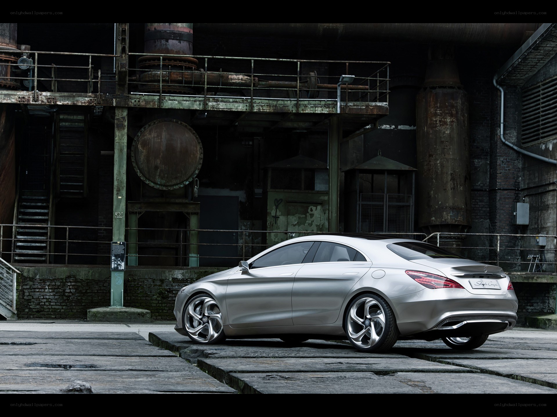 Silver concept car in industrial setting