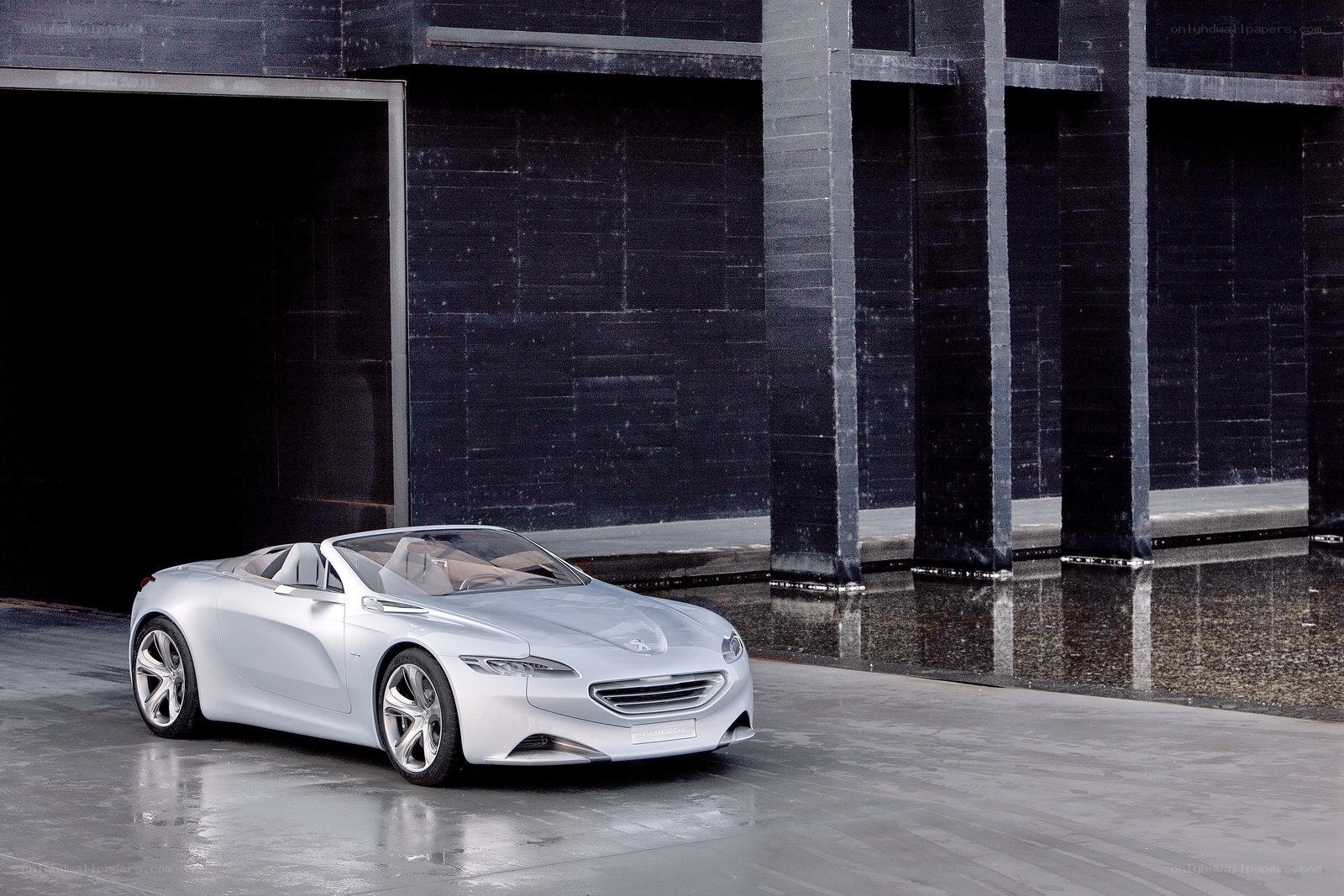 Silver concept car in modern setting