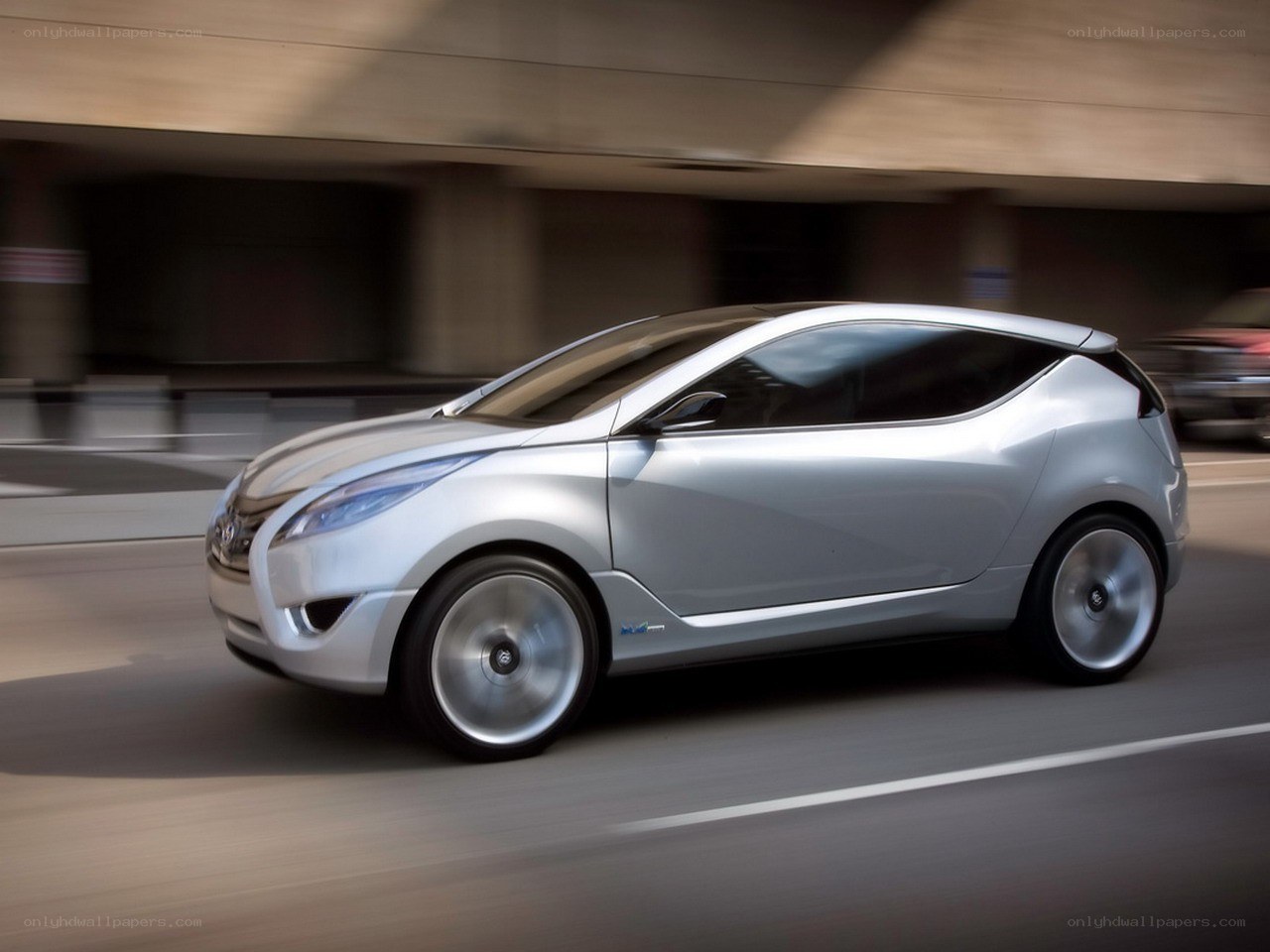 silver concept car in motion