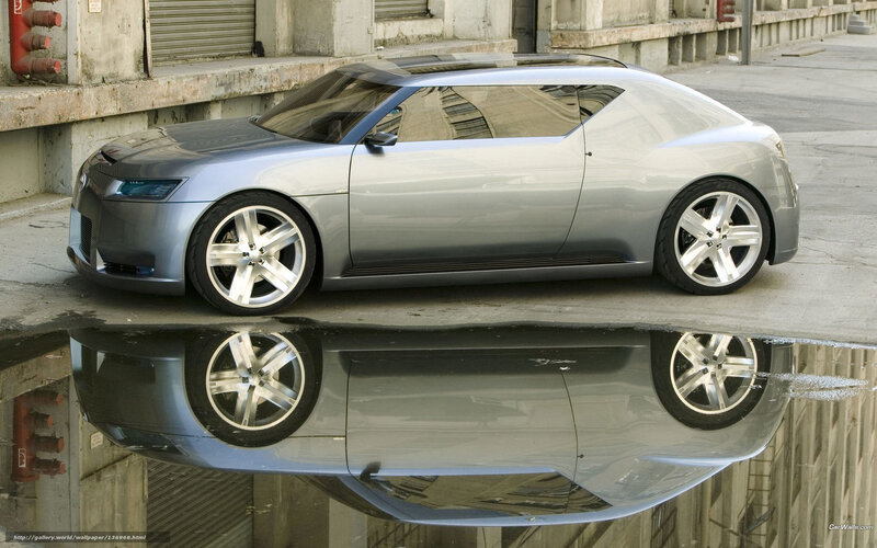 Silver concept car in puddle