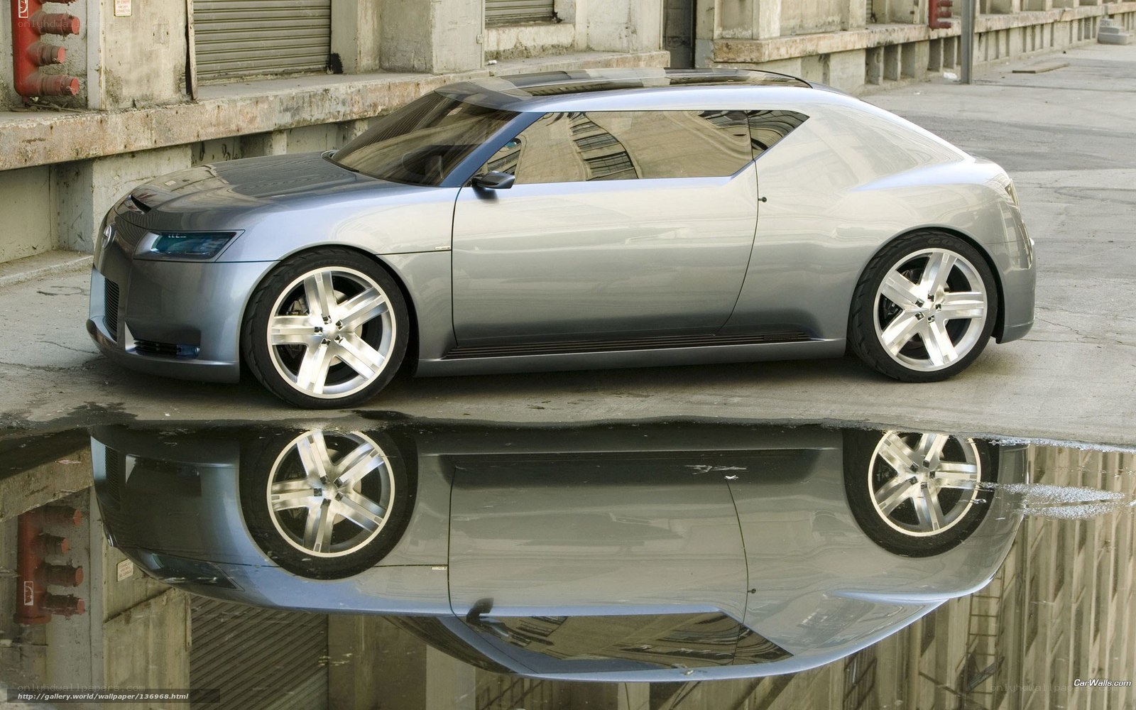 Silver concept car in puddle