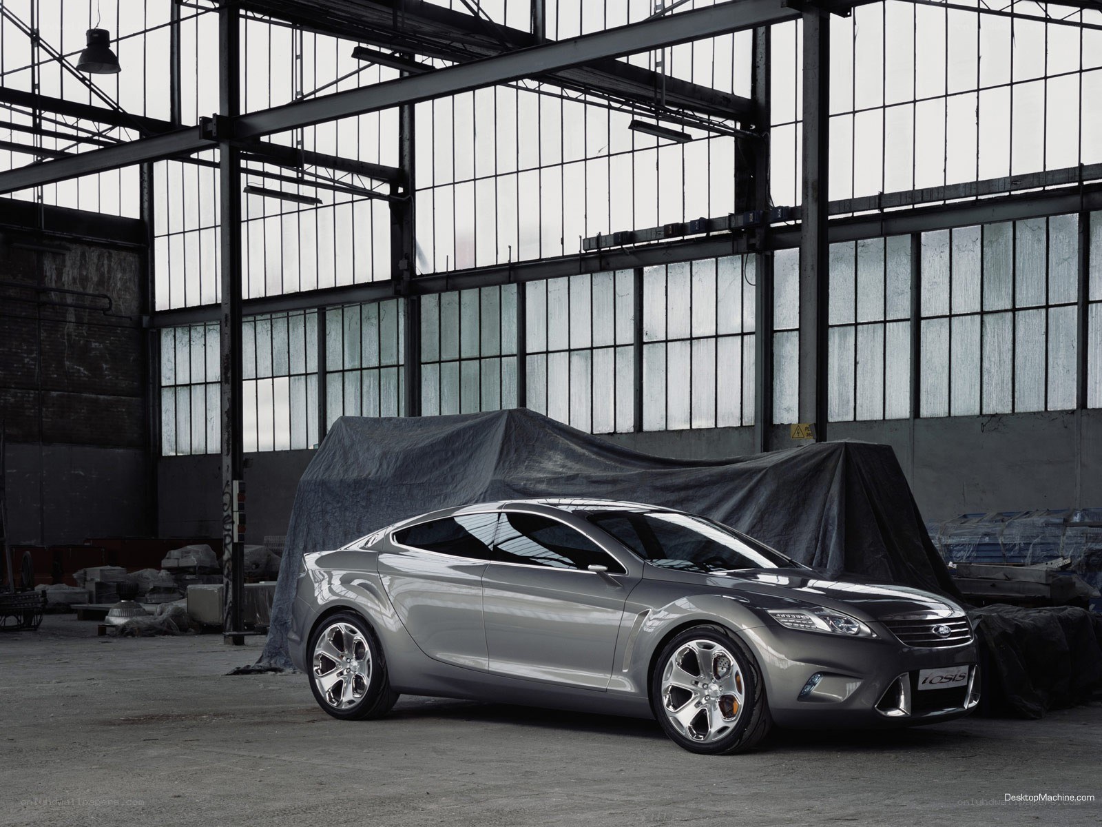 Silver concept car in warehouse
