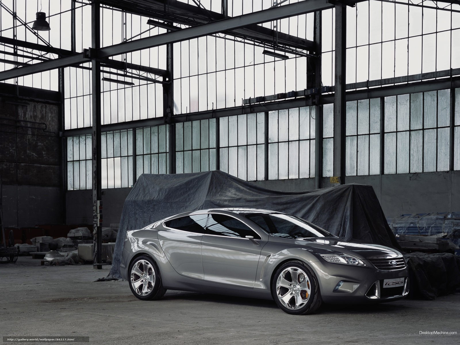 Silver concept car in warehouse