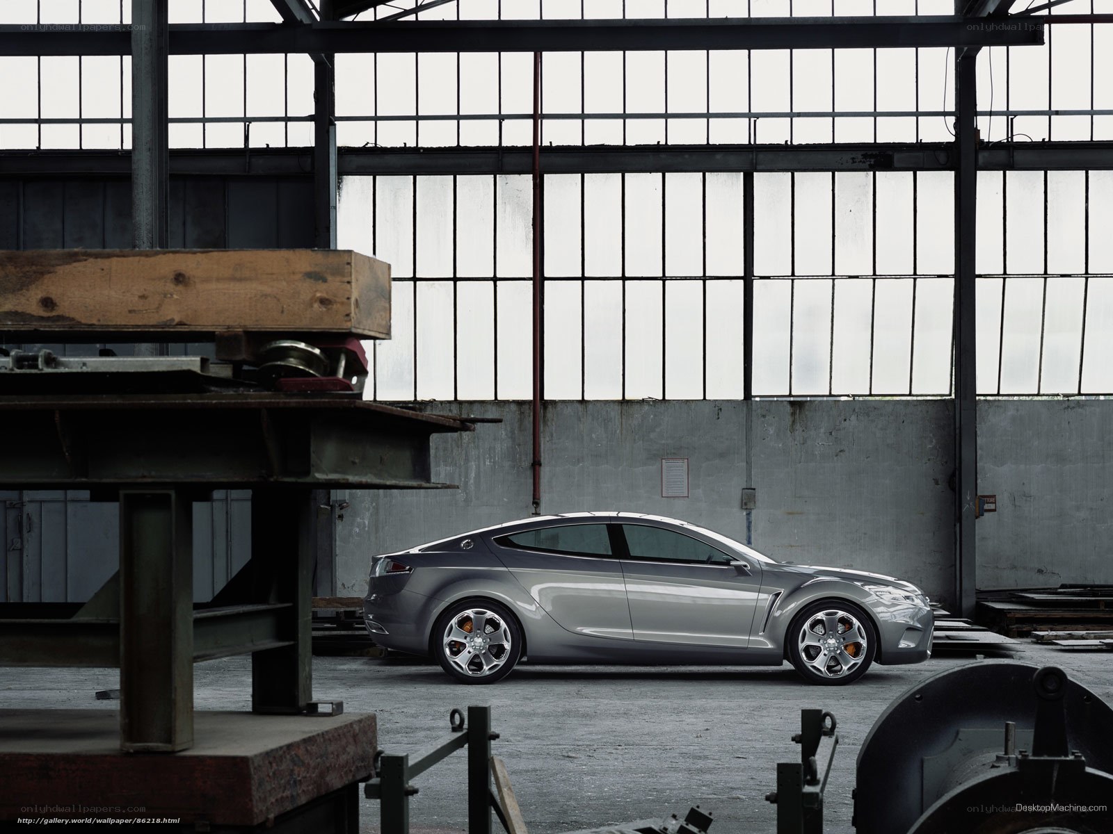 silver concept car in warehouse