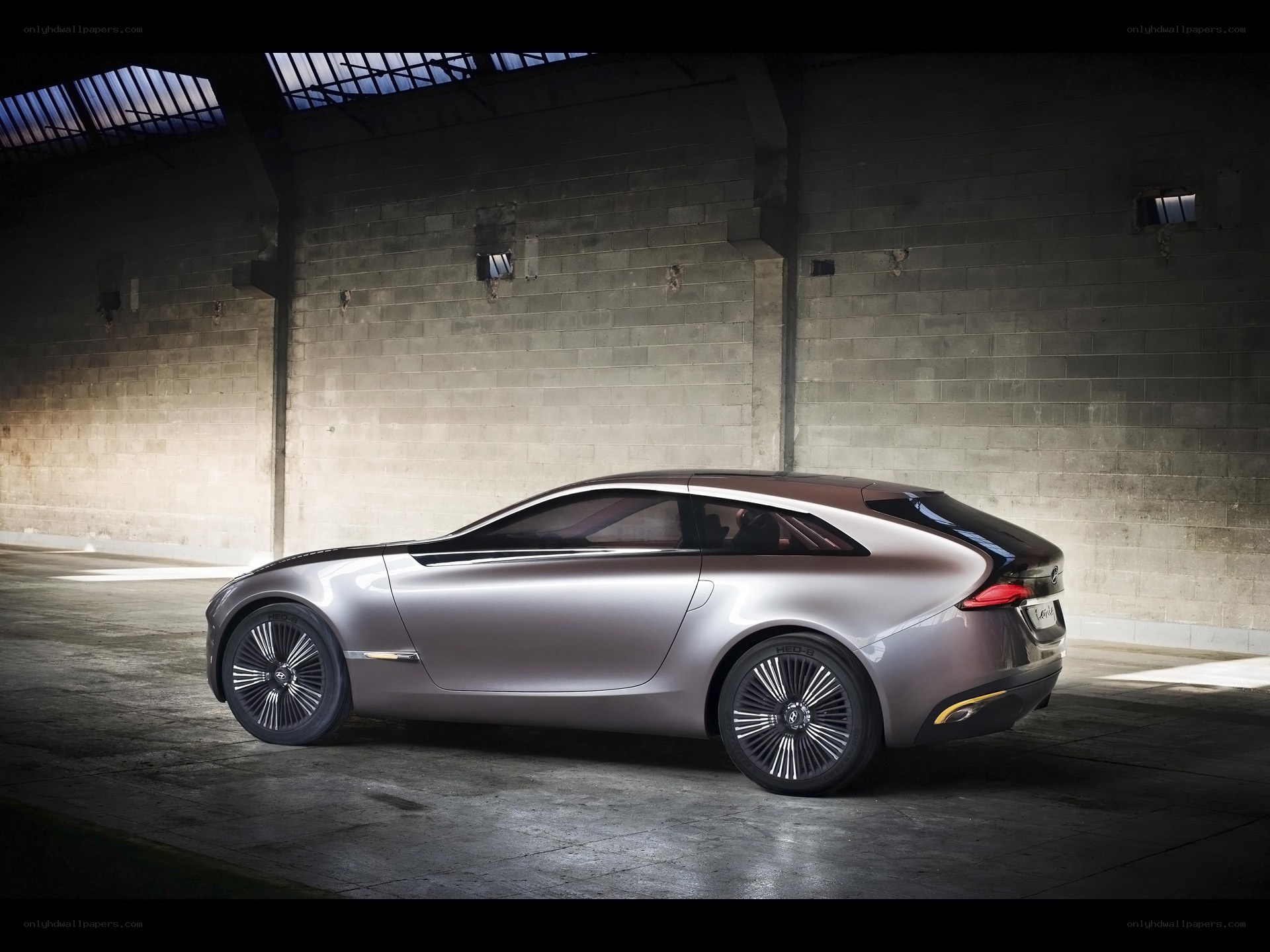silver concept car in warehouse