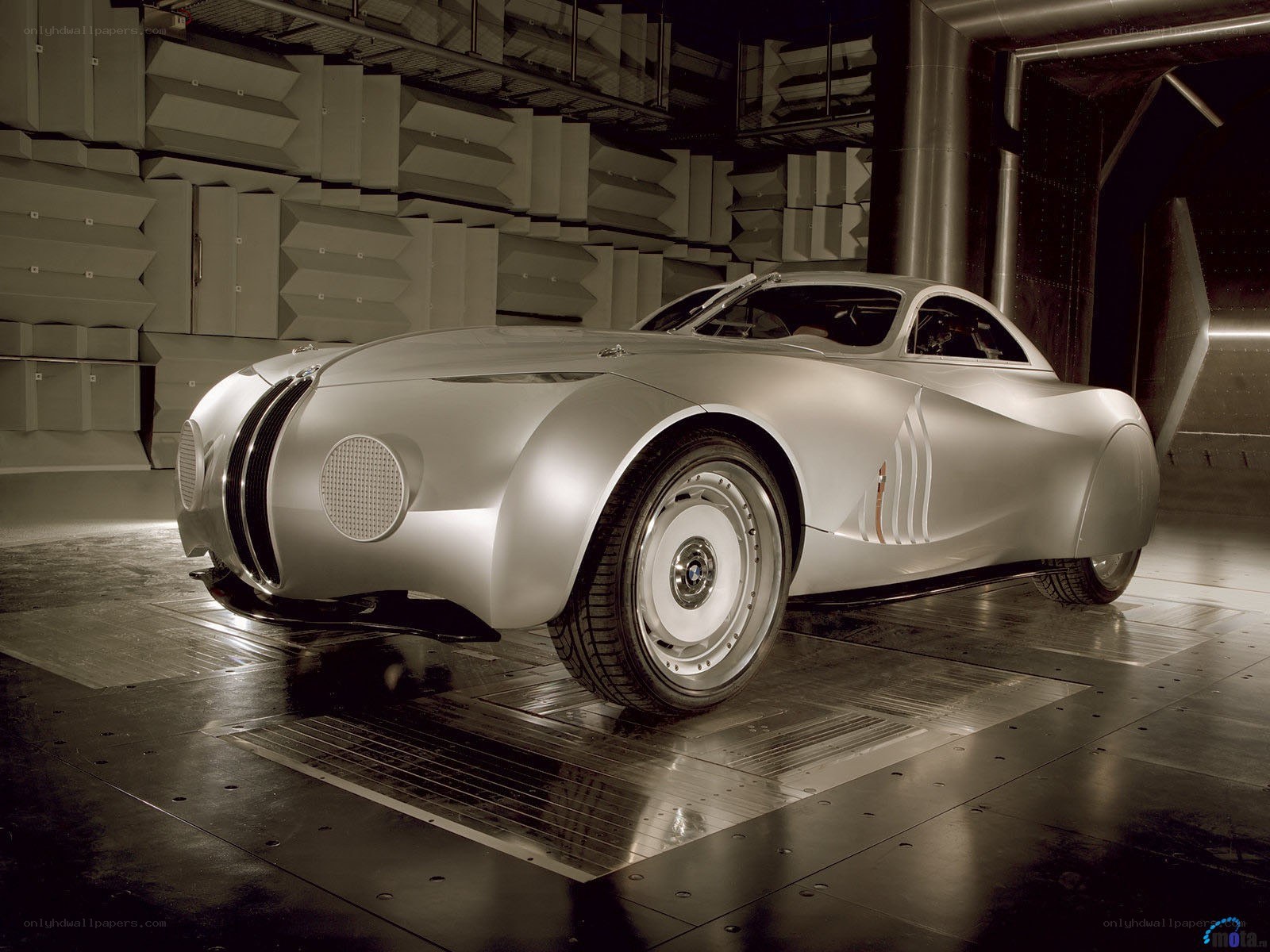 silver concept car in wind tunnel