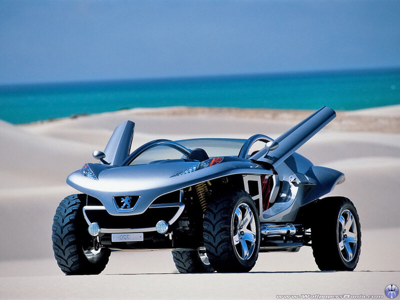Silver concept car on beach