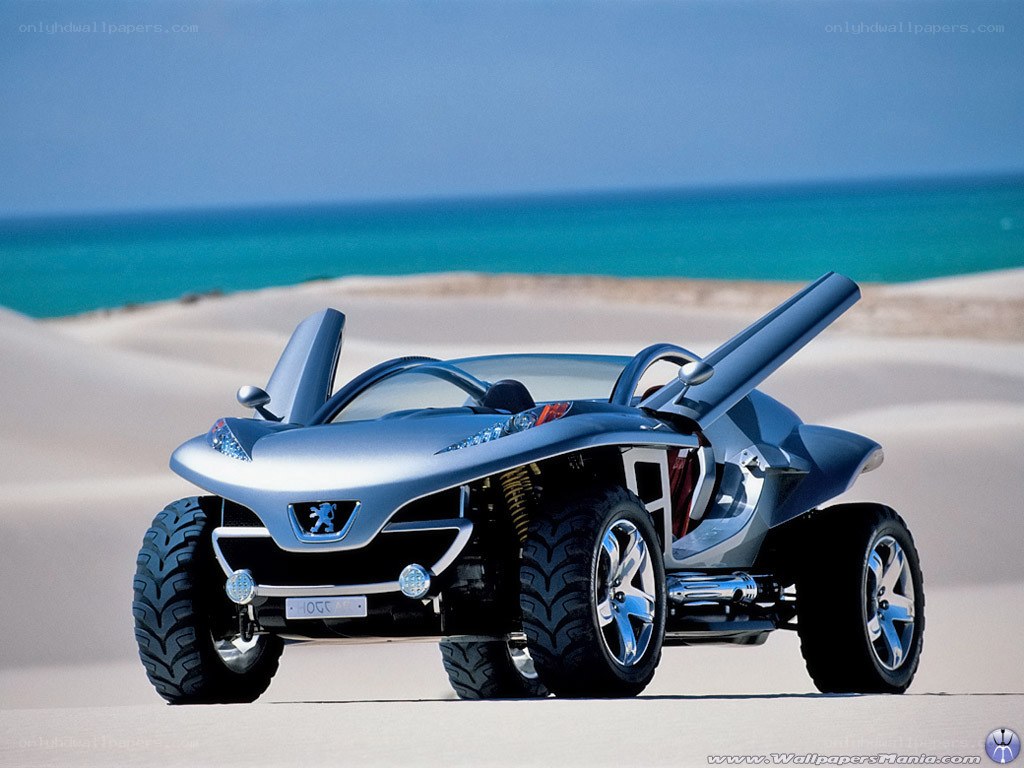 Silver concept car on beach