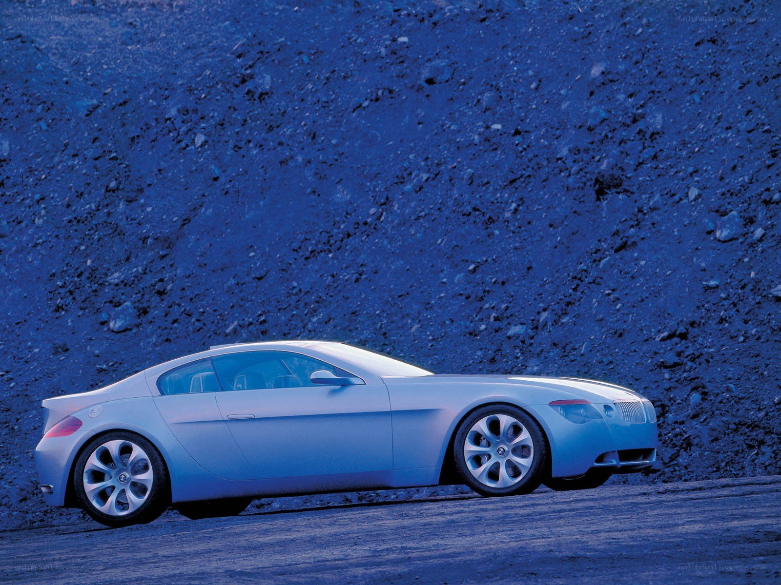 silver concept car on blue terrain