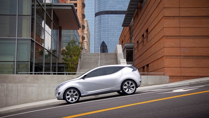 Silver concept car on city street