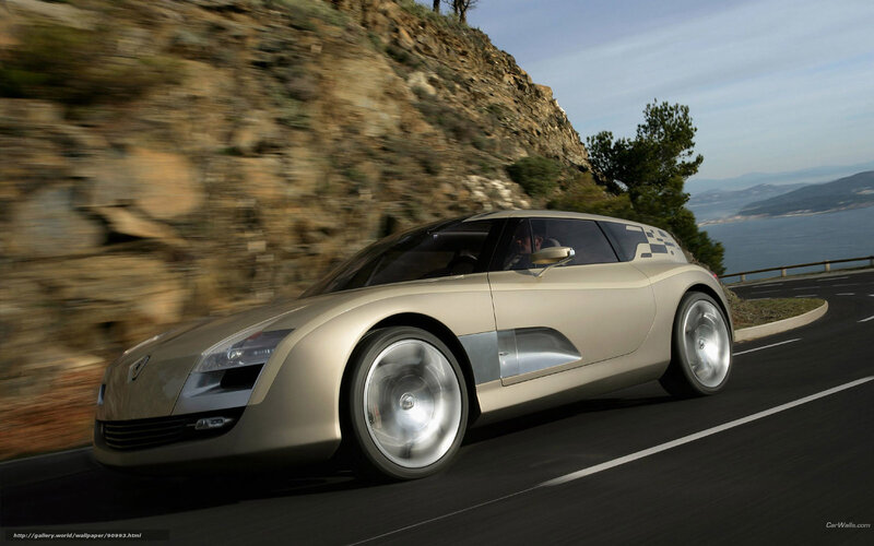 silver concept car on coastal road