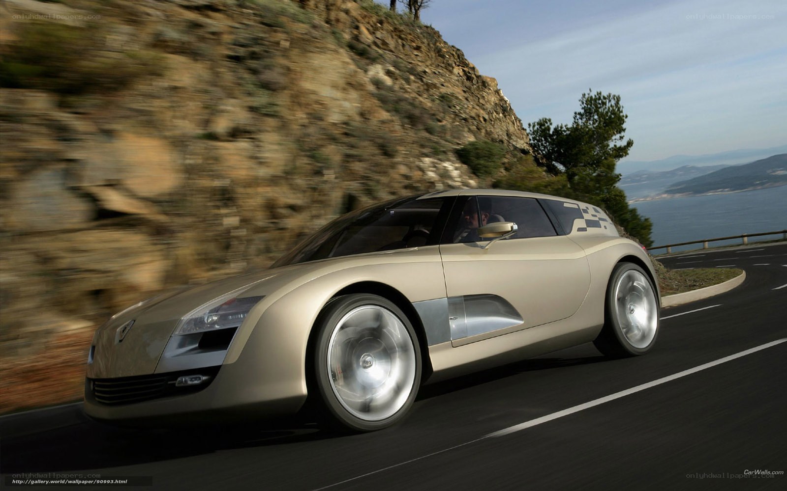 silver concept car on coastal road