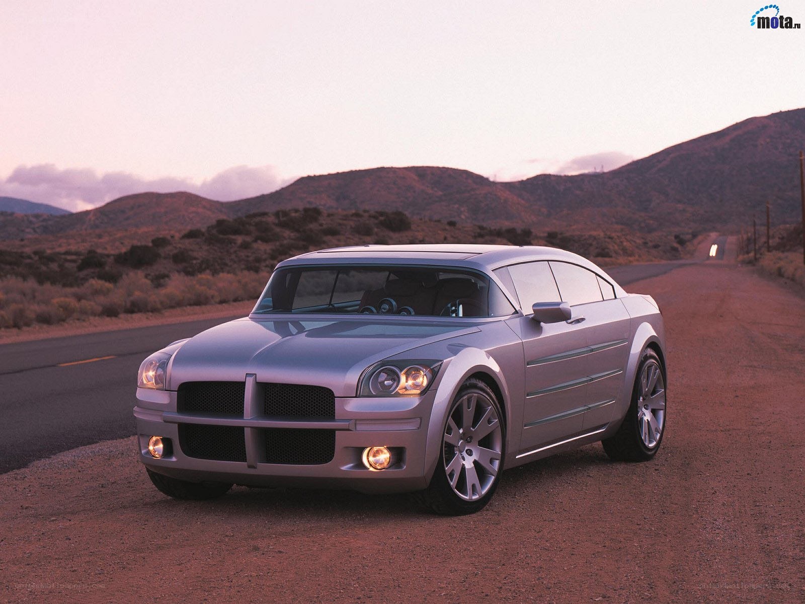 silver concept car on desert road