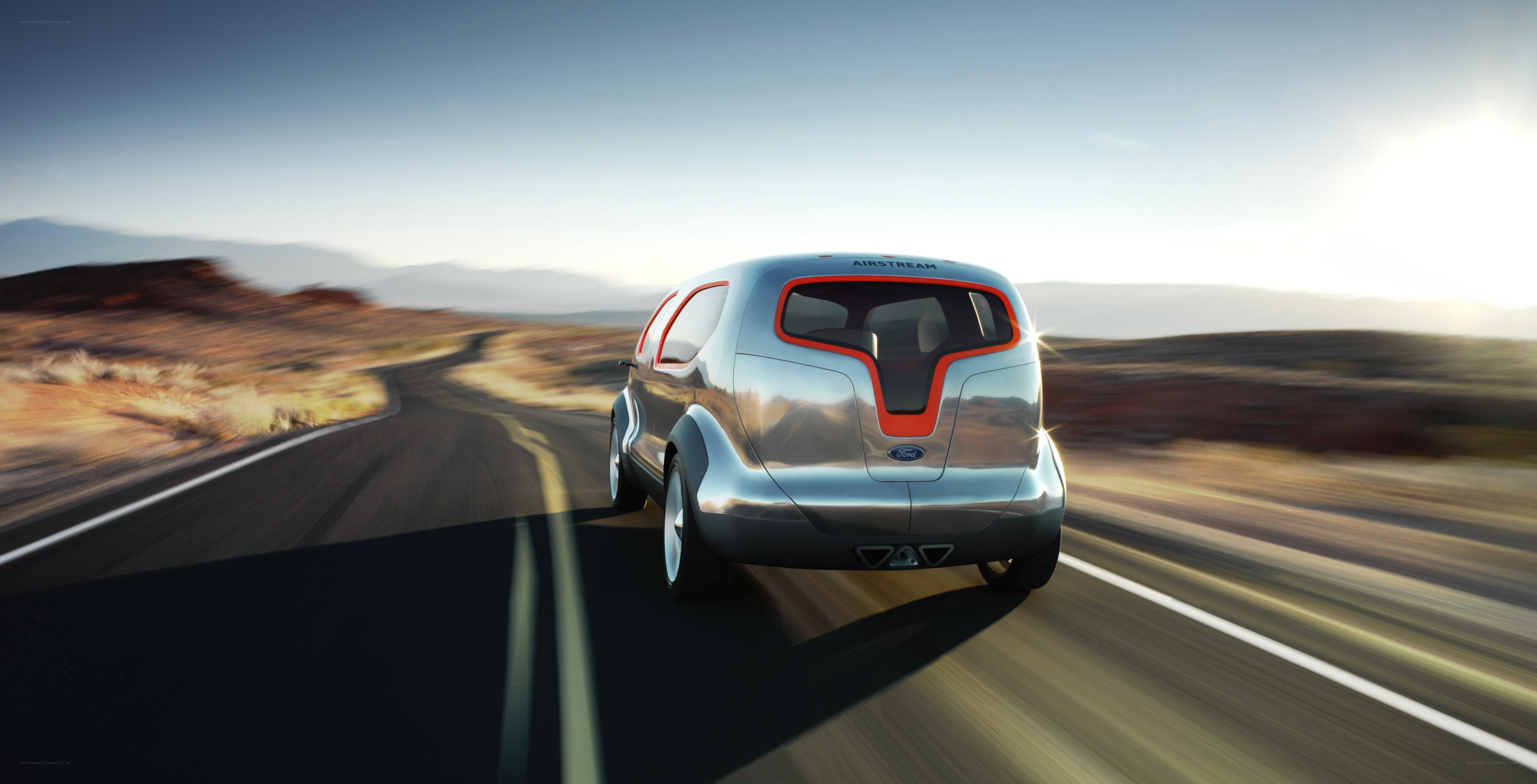 Silver concept car on desert road