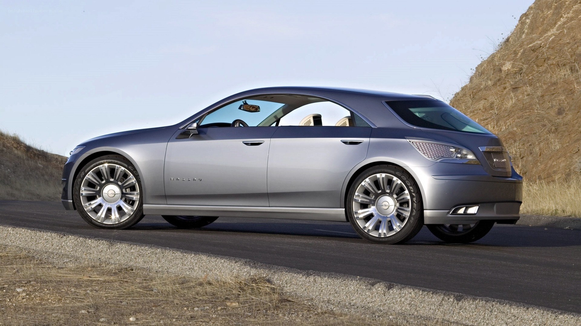 silver concept car on road