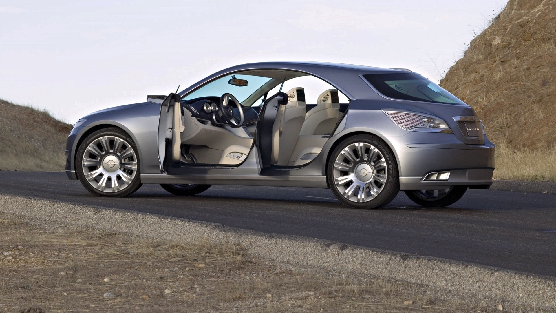 silver concept car on road