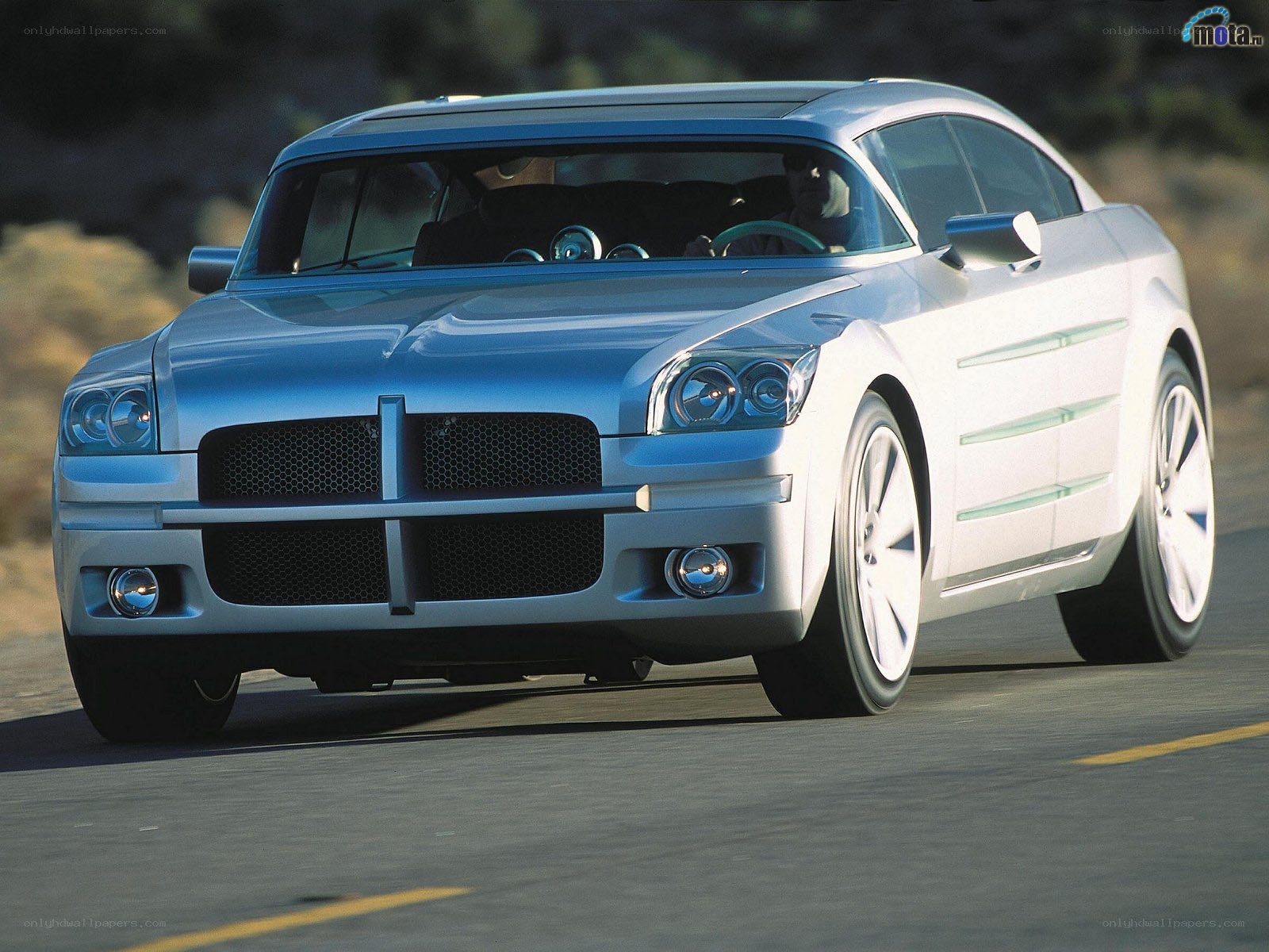 silver concept car on road