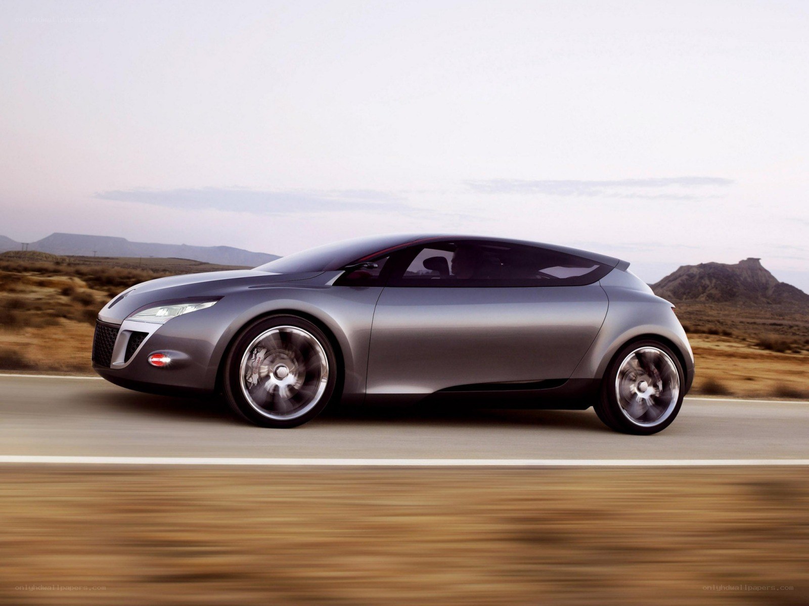 silver concept car on road