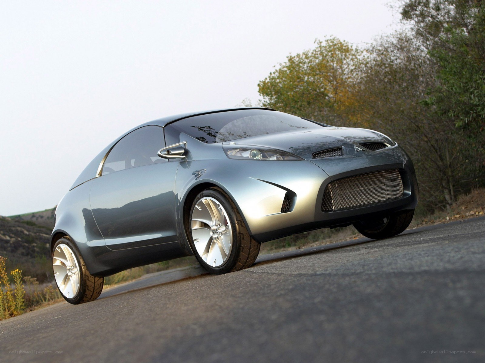 silver concept car on road
