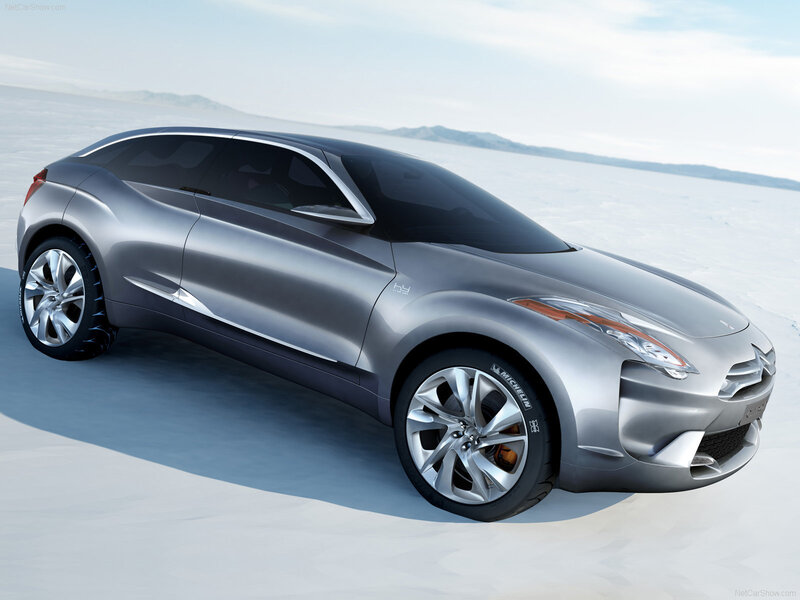 silver concept car on salt flat
