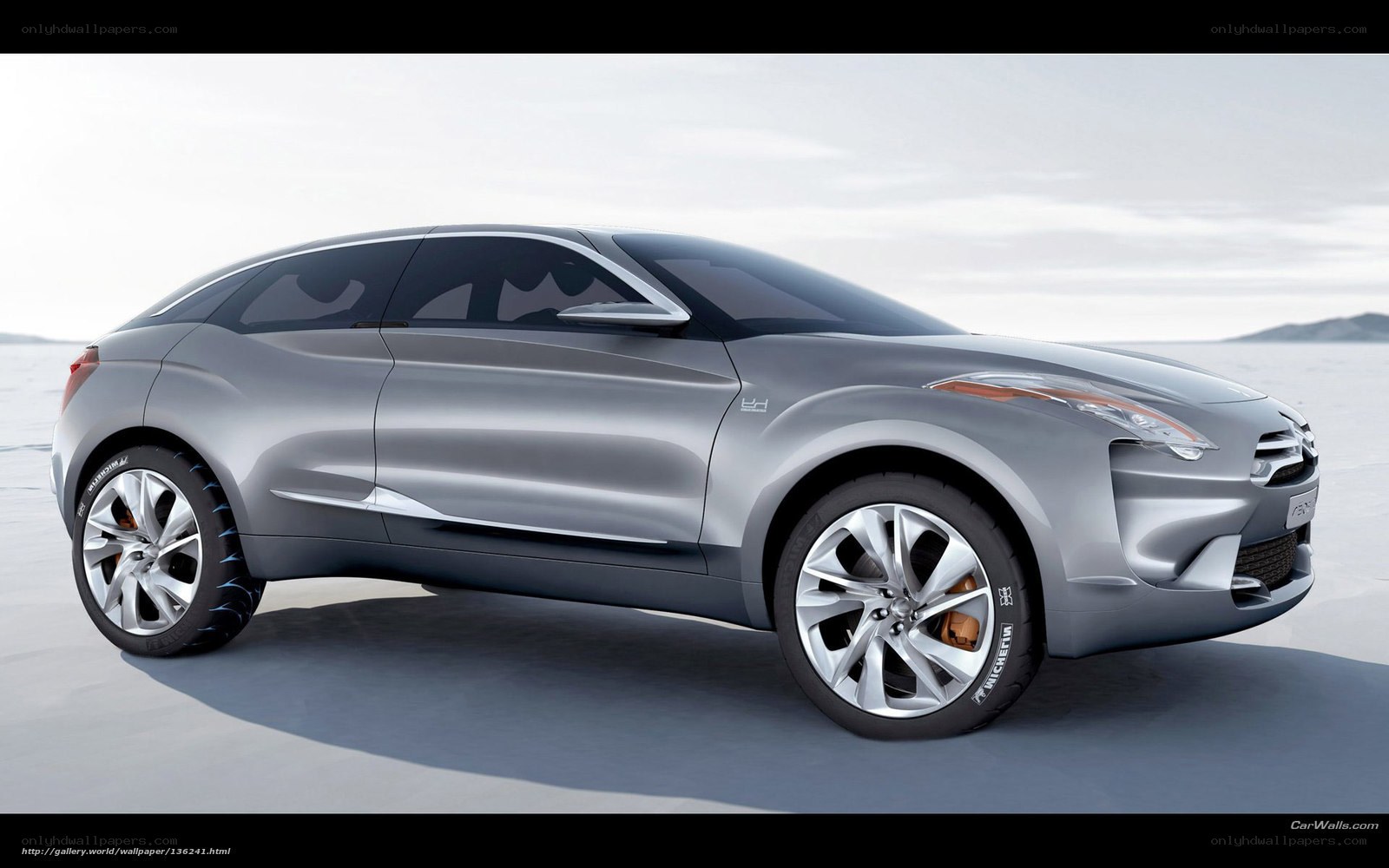 Silver concept car on salt flat