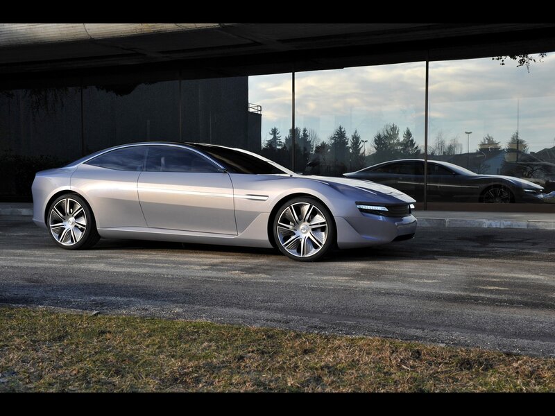 Silver concept car under overpass