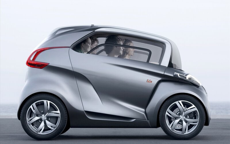 silver concept car with passengers