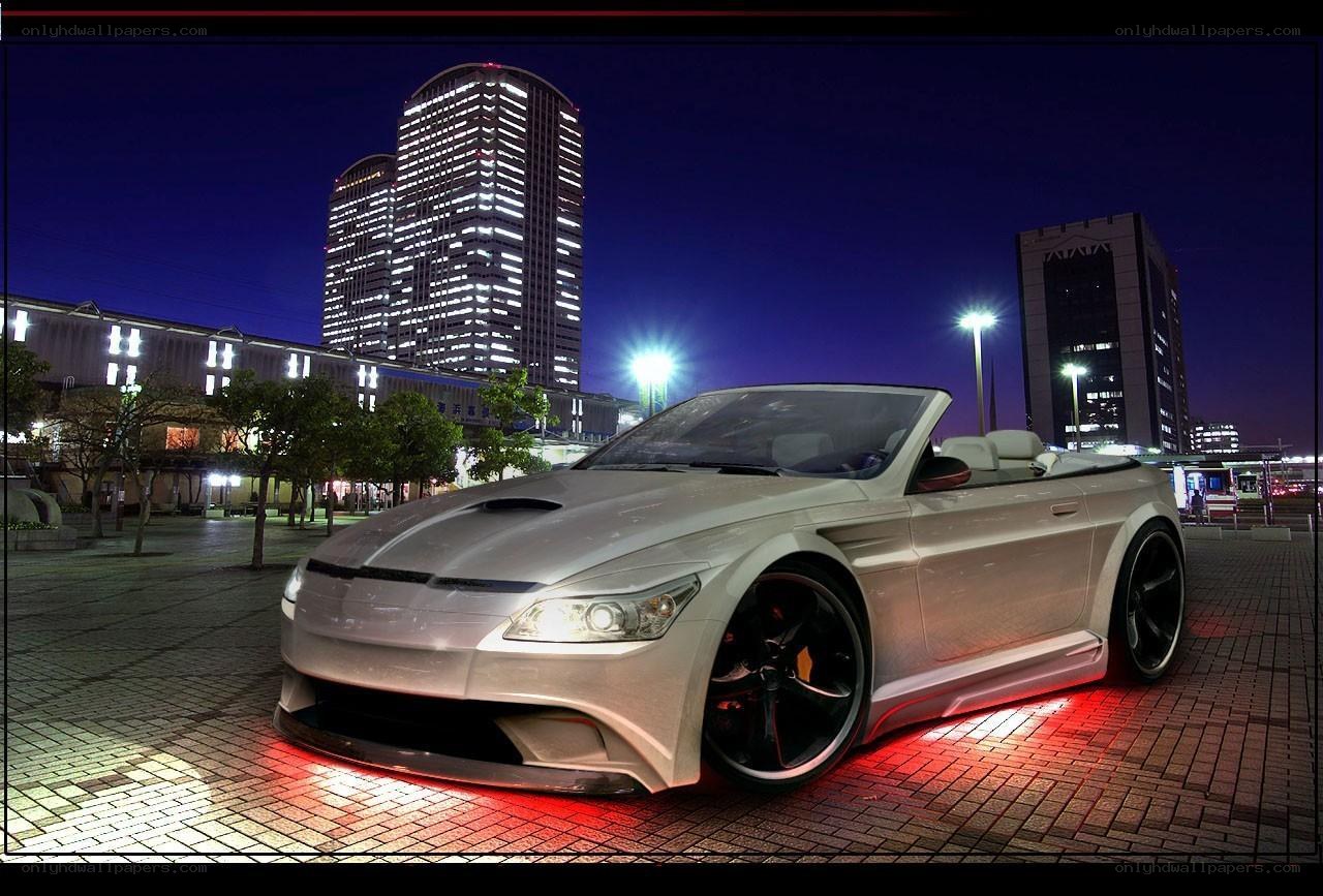 Silver convertible at night