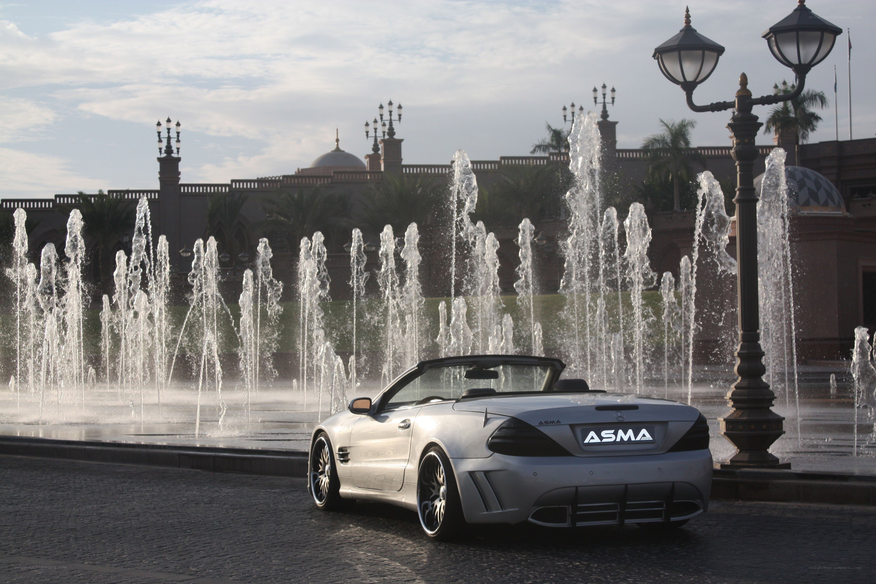 Silver convertible by fountain