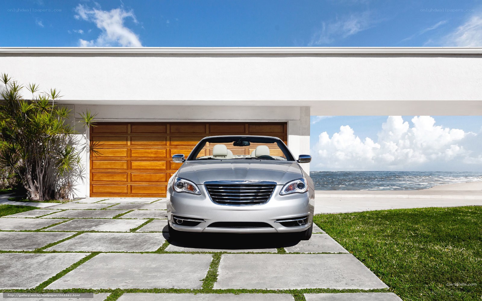 Silver convertible by the beach