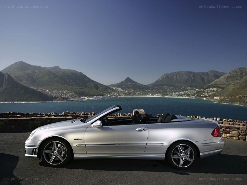 Silver convertible by the coast