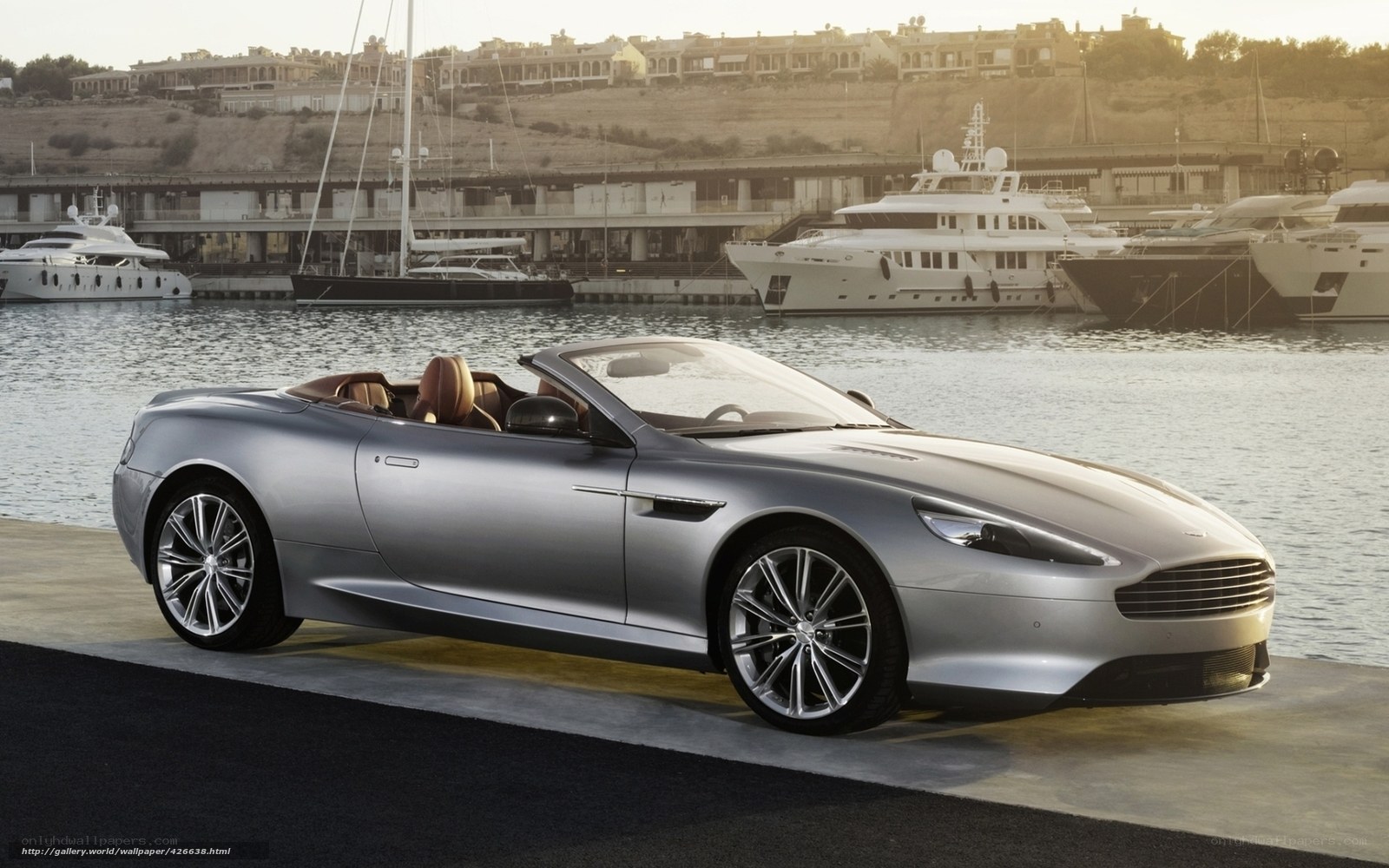 Silver convertible by the marina