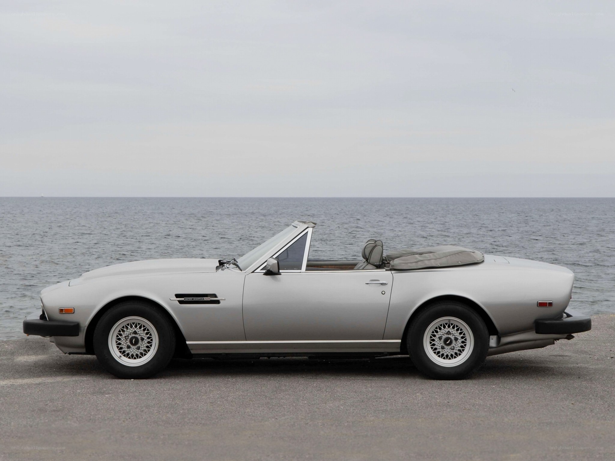 Silver convertible by the sea