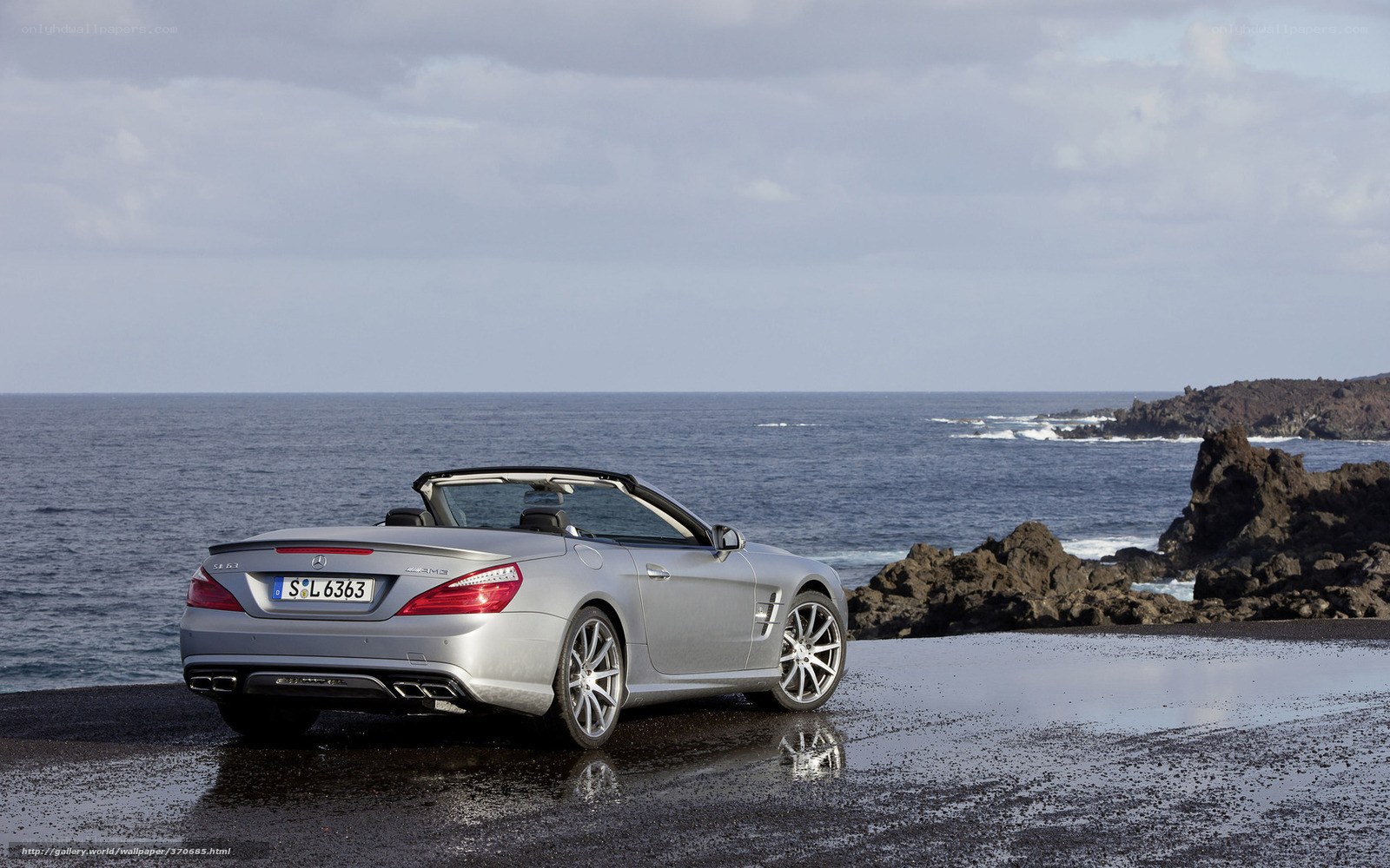 Silver convertible by the sea