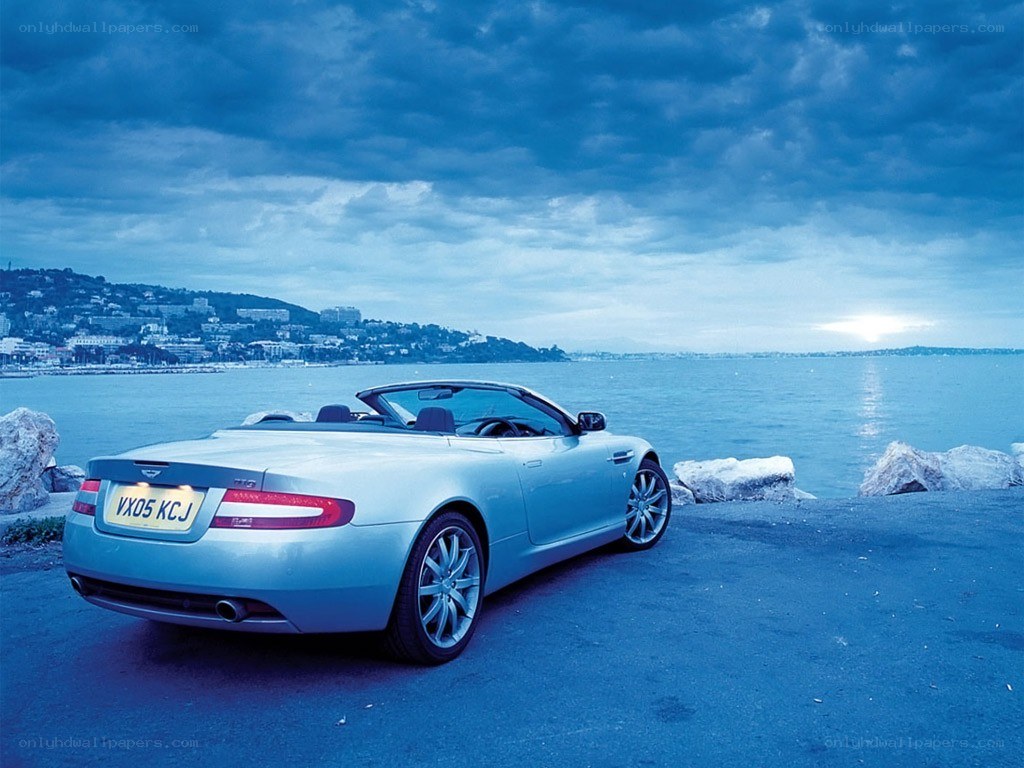 Silver convertible by the sea