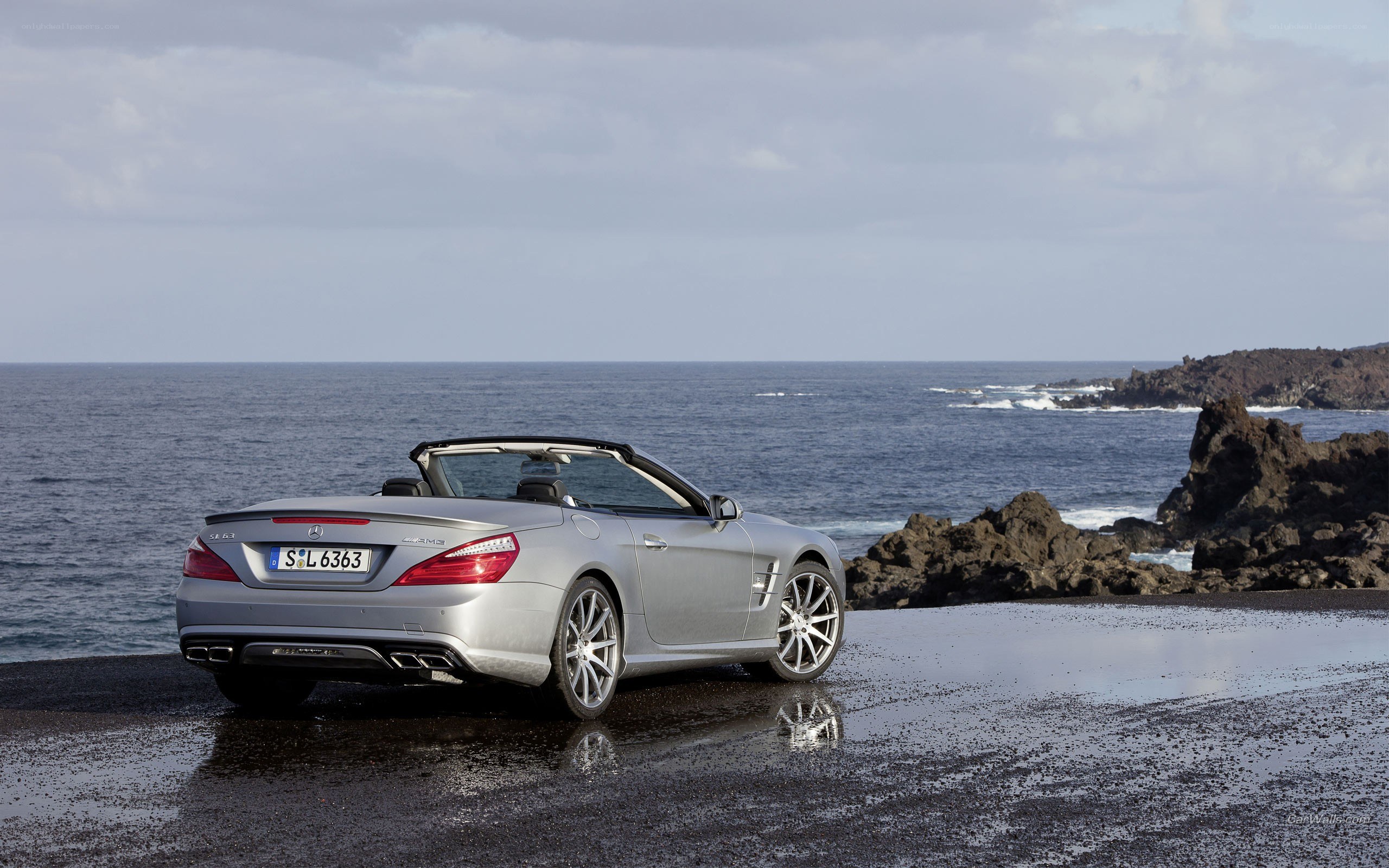 Silver convertible by the sea