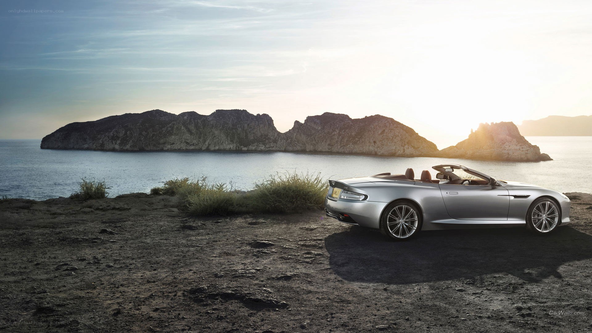 Silver convertible by the sea