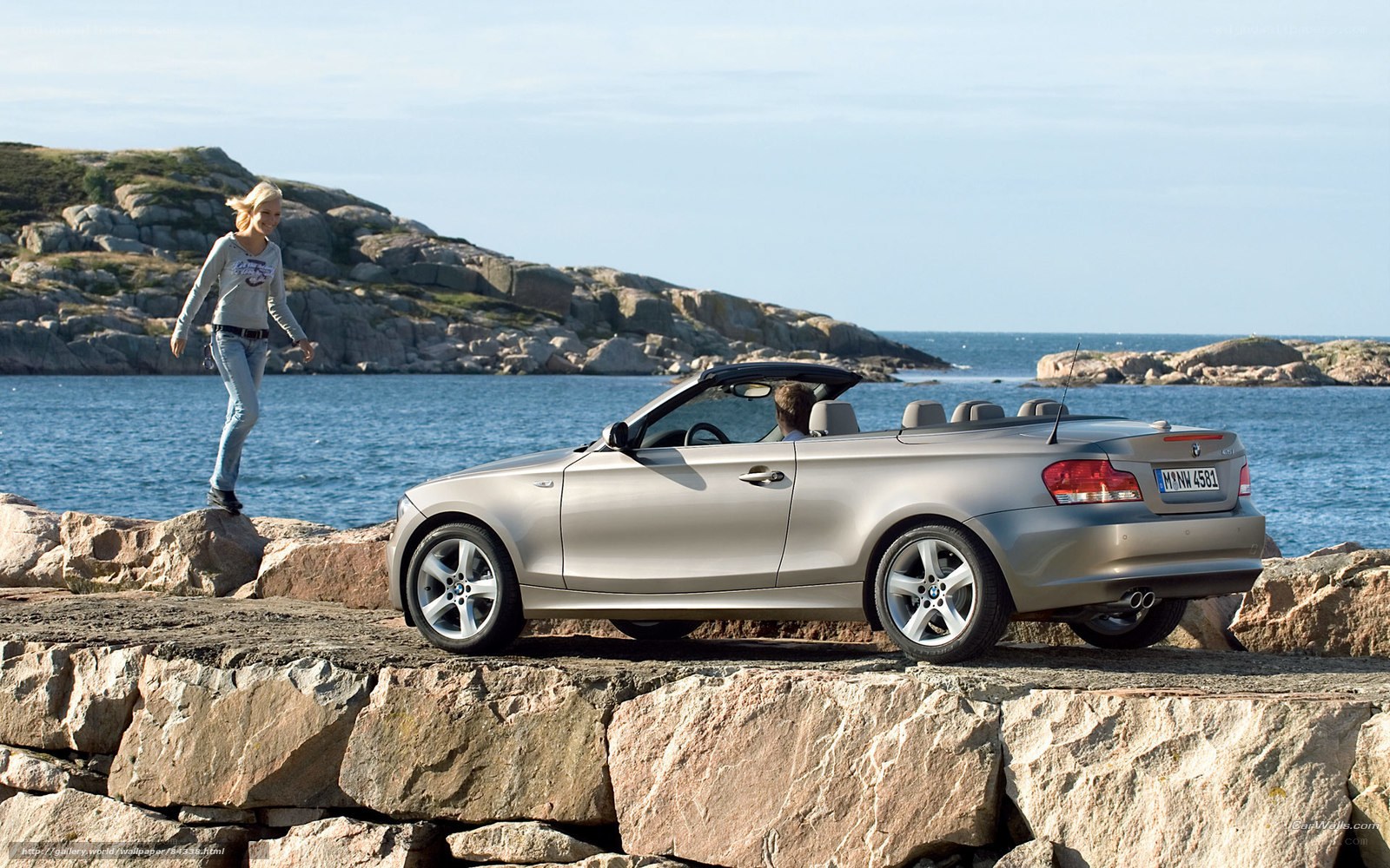 Silver convertible by the sea