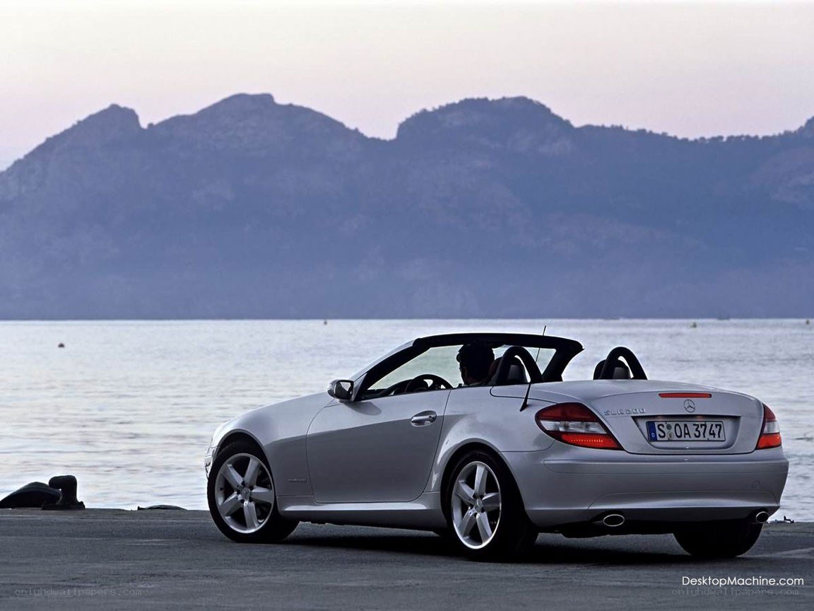 Silver convertible by the water