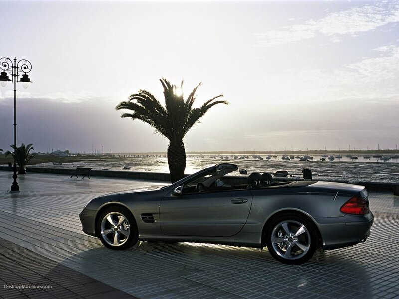 Silver convertible by the waterfront