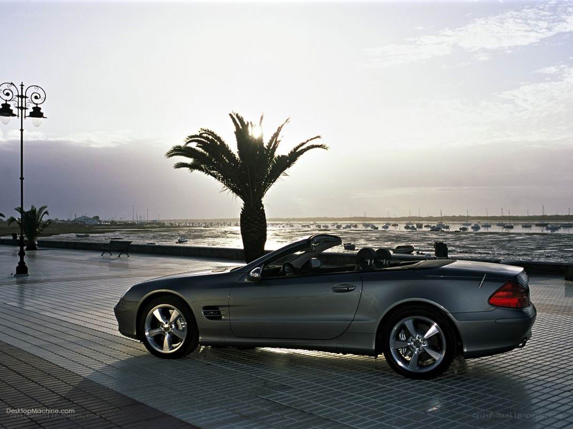 Silver convertible by the waterfront