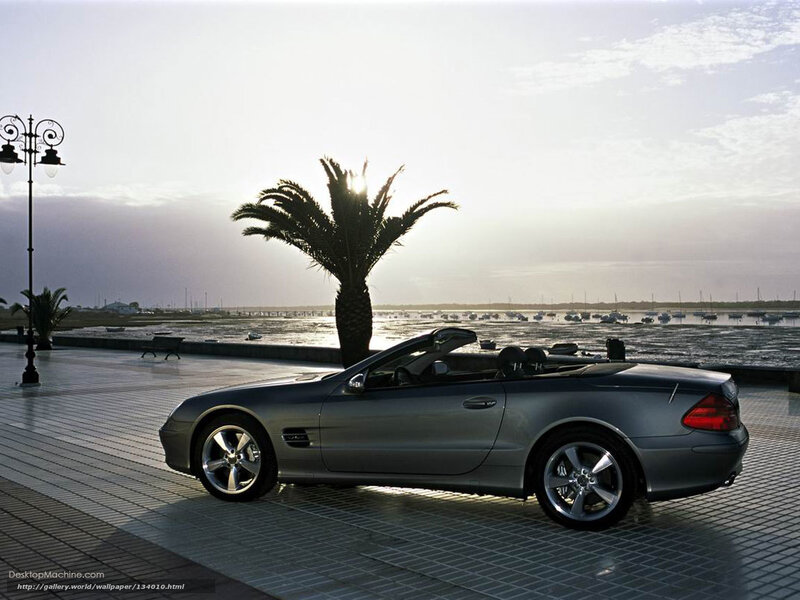 Silver convertible by the waterfront