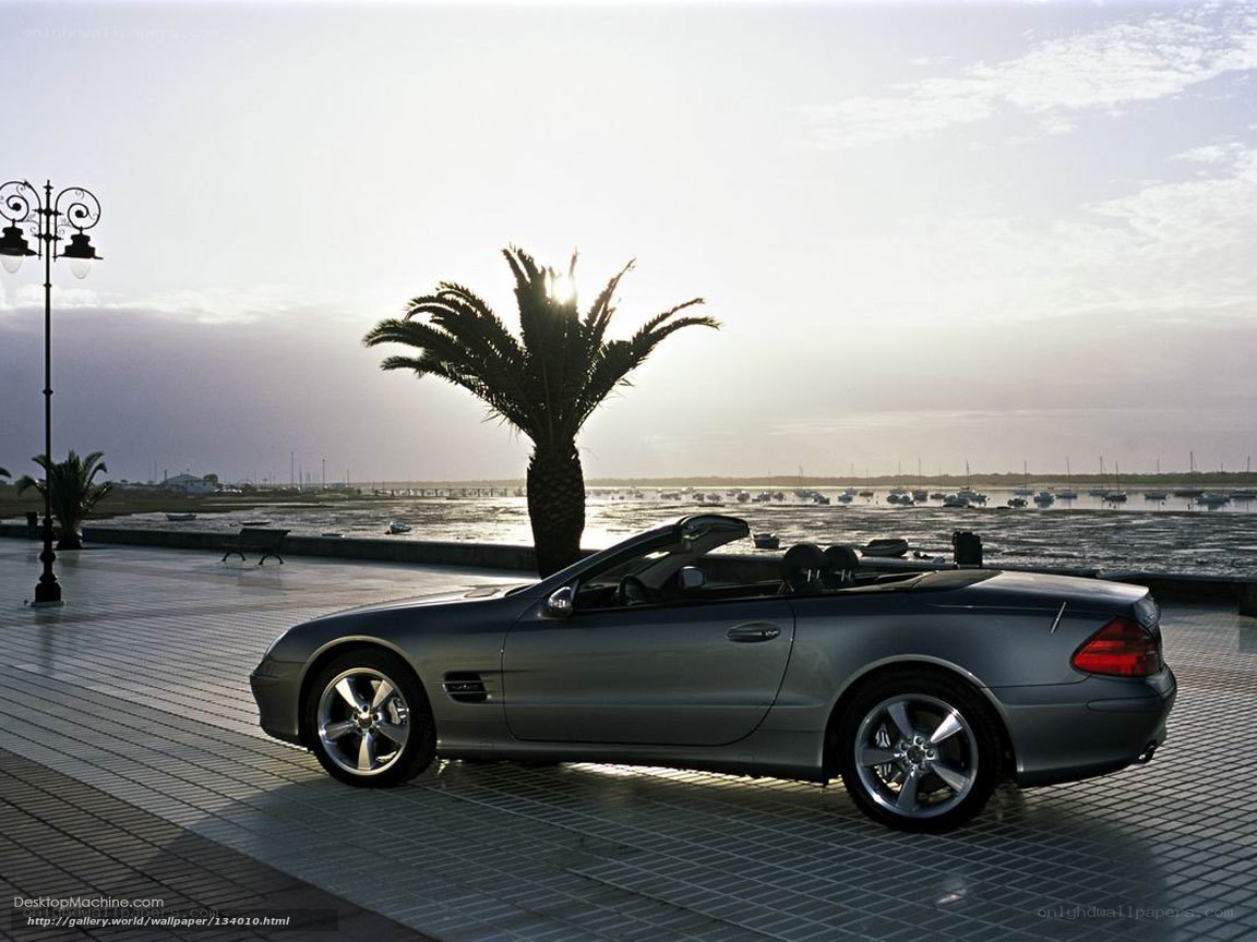 Silver convertible by the waterfront