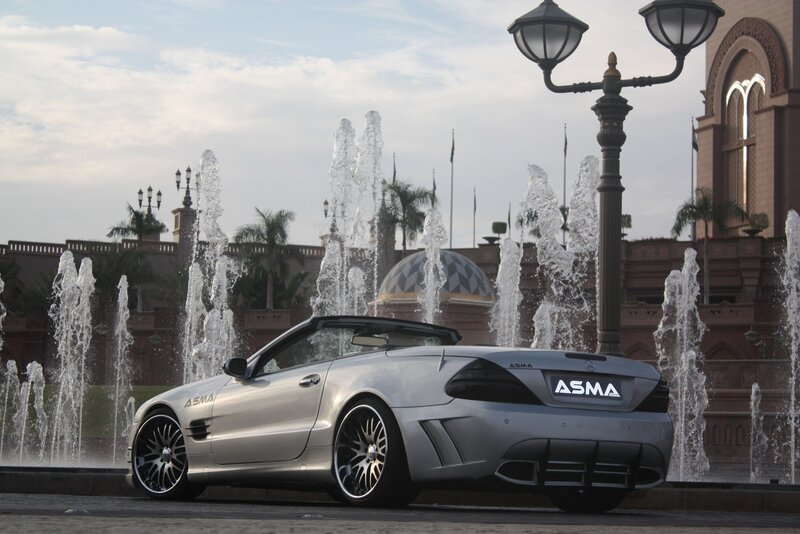Silver convertible car at fountain