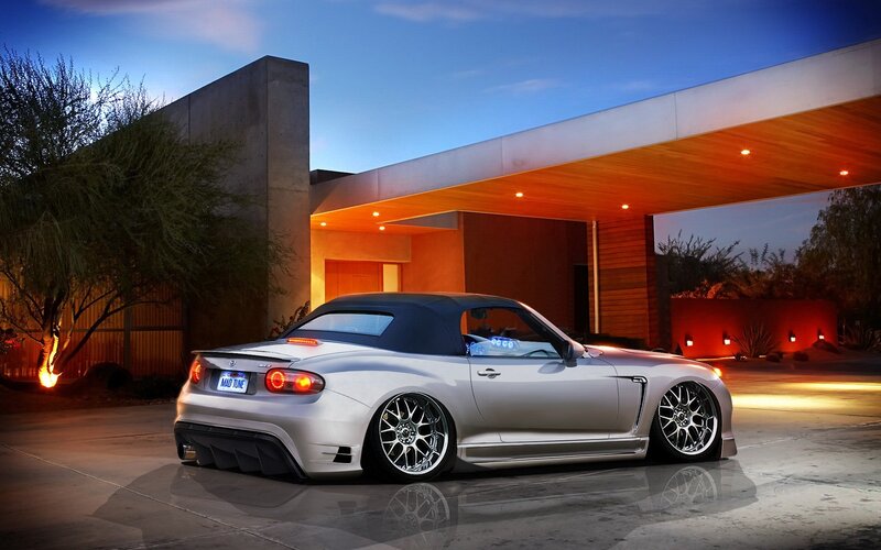 silver convertible car at modern home