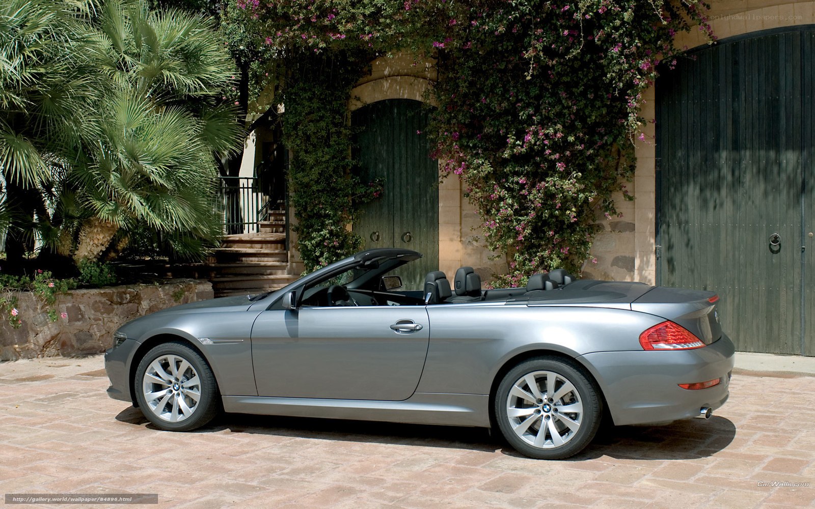 silver convertible car in courtyard
