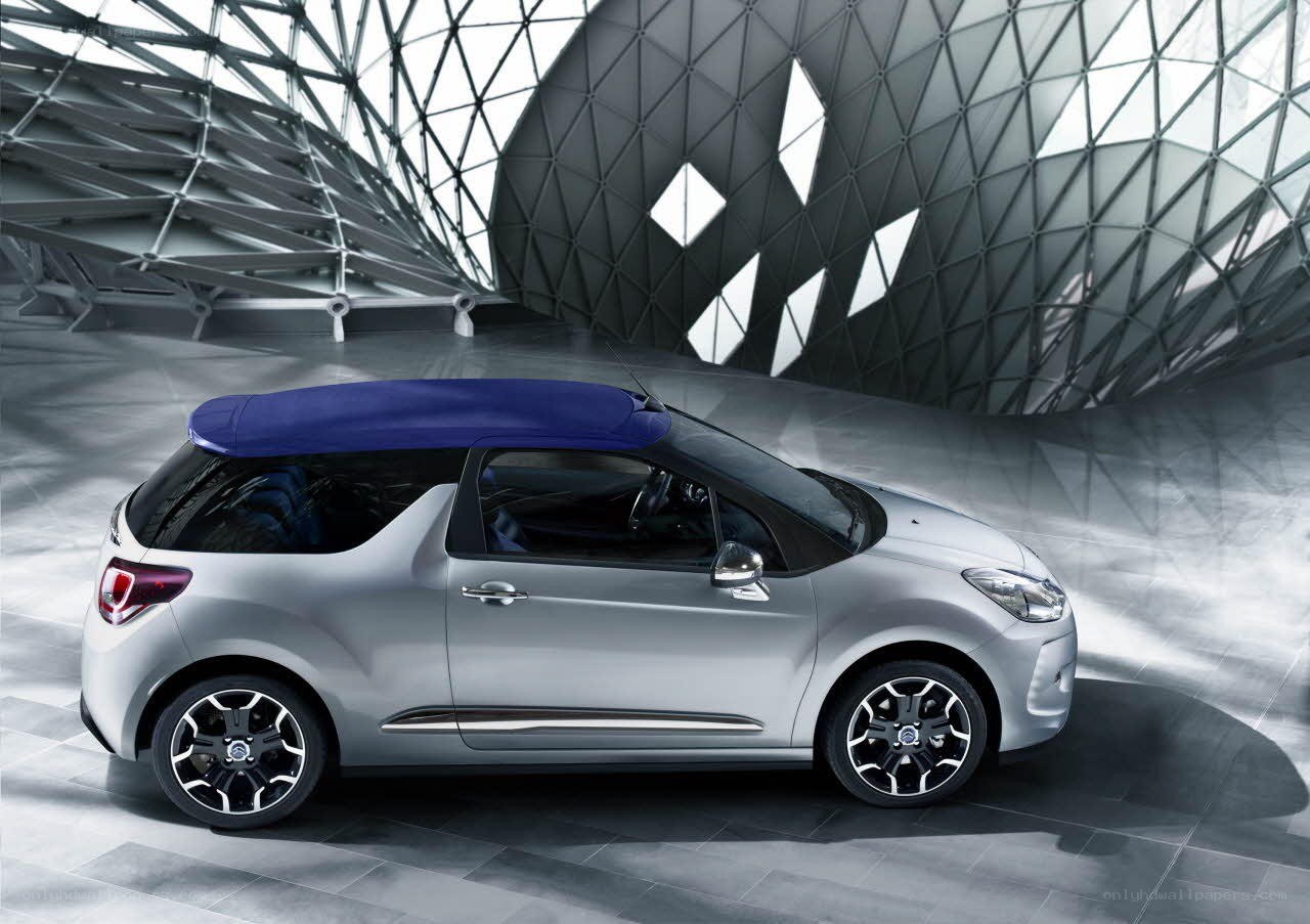 Silver convertible car in modern space