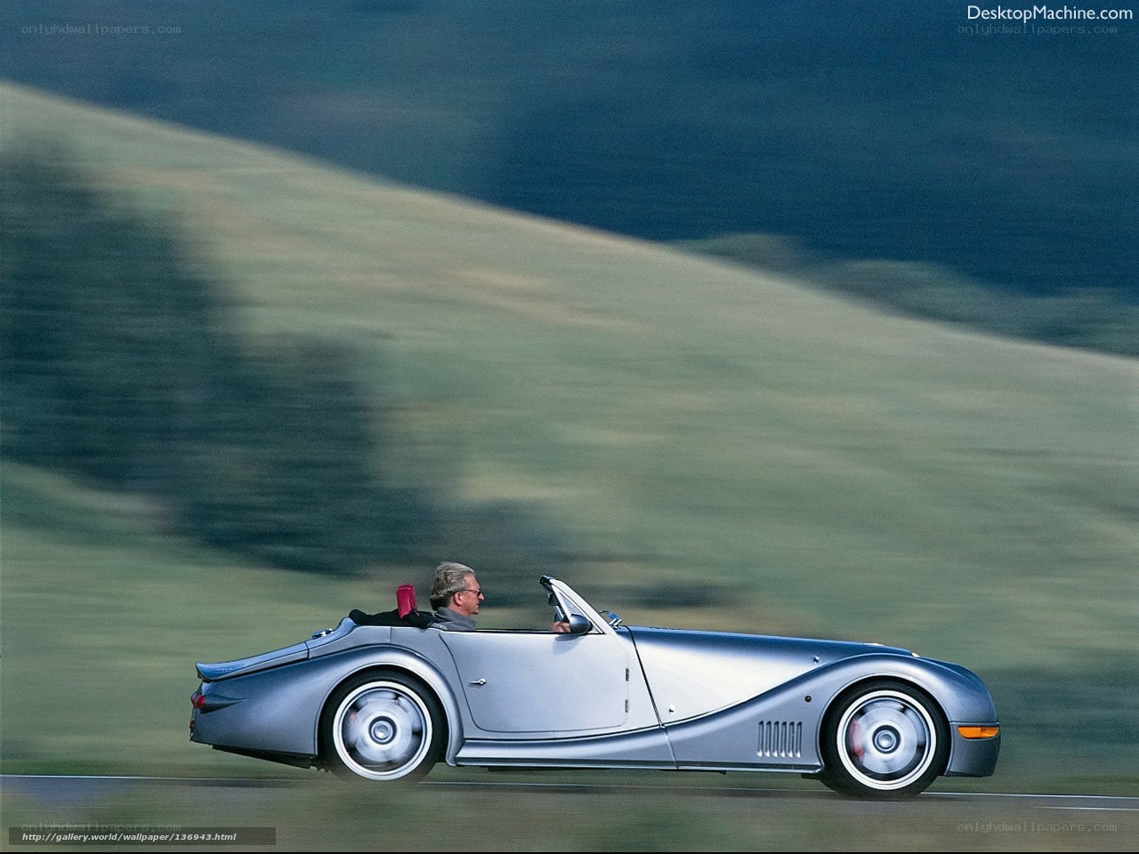 Silver convertible car on road