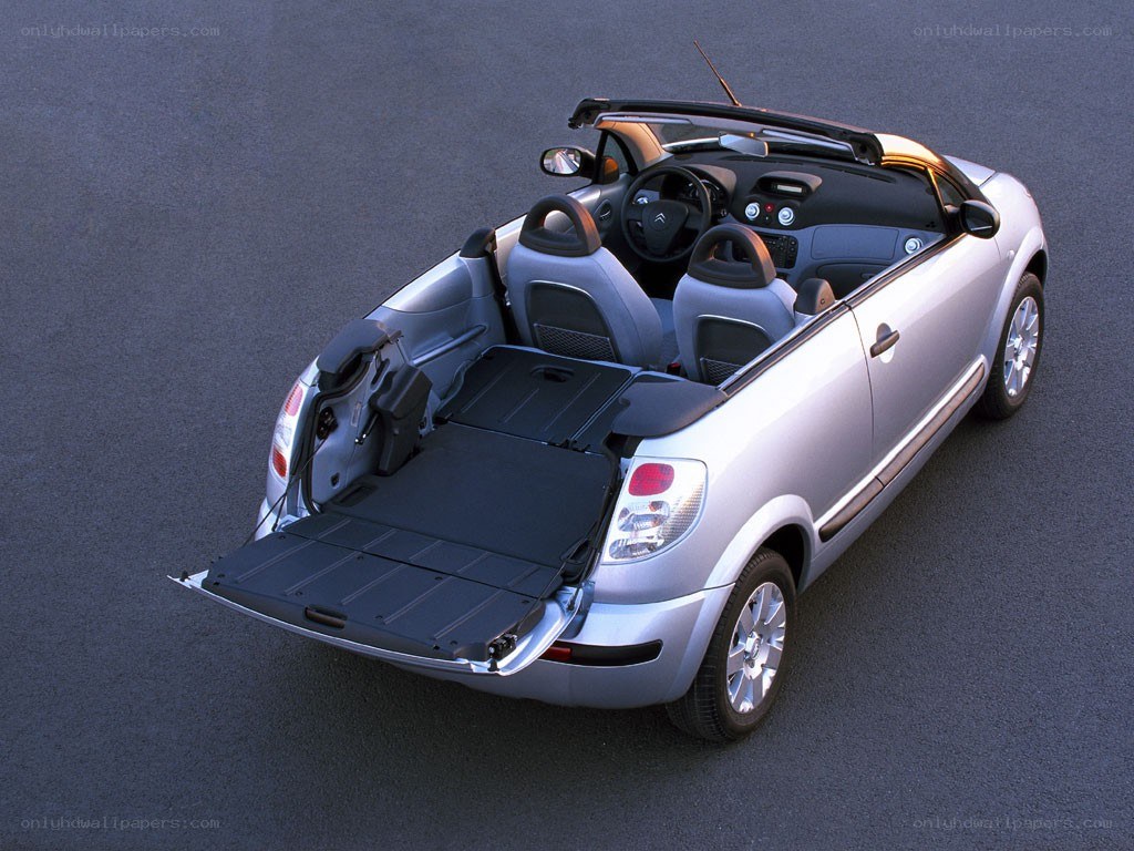 silver convertible car with trunk open
